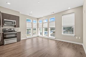 Nashville apartment for rent - a living room with hardwood floors and large windows
