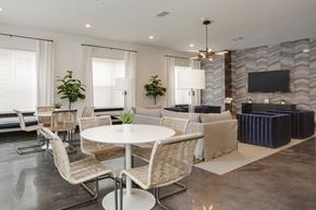 Nashville apartment for rent - A modern dining room with a white table and chairs.