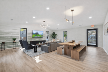 Smyrna apartment for rent - A modern living room with a black chair and a wooden coffee table.