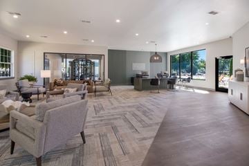 Bowling Green apartment for rent - A spacious living room with a grey carpet and furniture.