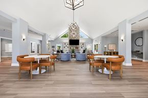 Sanford apartment for rent - A modern dining room with a white table and chairs.