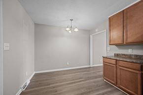 Jacksonville apartment for rent - A room with wooden floors and a brown cabinetry.