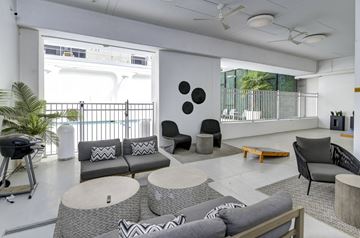 Columbia apartment for rent - A modern living room with a grey sofa and a coffee table.
