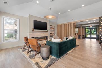 Fayetteville apartment for rent - a living room with a couch and a table with chairs