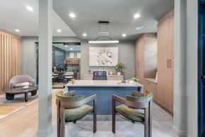 Fayetteville apartment for rent - a dining room with a blue counter and chairs