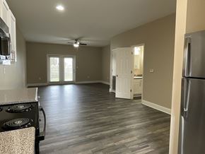 West Columbia townhouse for rent - A kitchen with a stove top oven and a refrigerator.