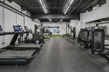 Columbia apartment for rent - A spacious gym with treadmills, elliptical machines, and other exercise equipment.