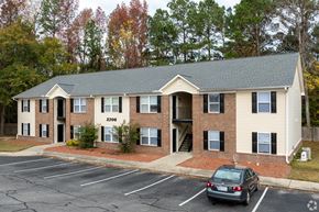 Fayetteville apartment for rent - A car is parked in a parking lot in front of a building with the number 2306 on it.