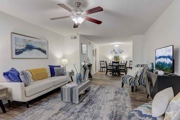 Greer apartment for rent - A living room with a white couch and a painting on the wall.