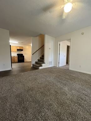 Fuquay-Varina townhouse for rent - A spacious living room with a staircase leading to the upper floor.