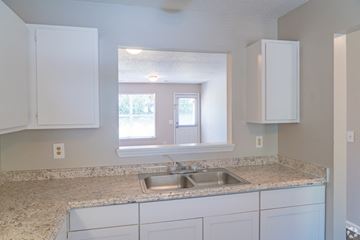 Holly Springs apartment for rent - A kitchen with a sink and cabinets.