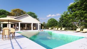 Leland townhouse for rent - A poolside area with a house and trees in the background.