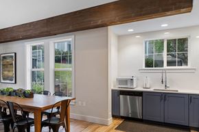 Portland apartment for rent - a kitchen with a table and a counter with two microwaves at Oriel Apartments, Portland, OR, 97225
