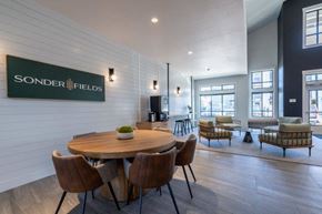 Happy Valley apartment for rent - a dining room with a wooden table and chairs at Sonder Fields in Happy Valley, OR