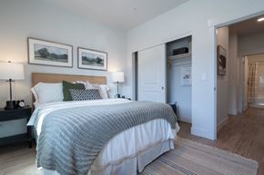 Happy Valley apartment for rent - a bedroom with a bed and a closet at Sonder Fields in Happy Valley, OR