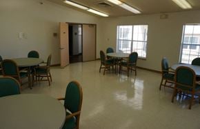 Grants apartment for rent - a dining room with tables and chairs