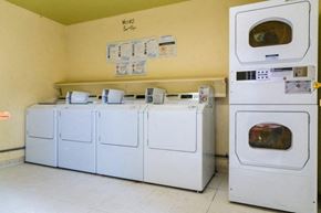 Simi Valley apartment for rent - a row of washes and dryers in a laundry room