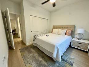 Thousand Oaks apartment for rent - A bedroom with a bed, nightstand, and rug.