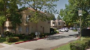 Simi Valley apartment for rent - an apartment building with cars parked in front of it