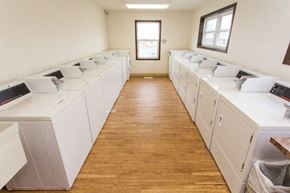 Dickinson apartment for rent - a washer and dryer room filled with white washing machines