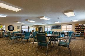 Dickinson apartment for rent - a dining room with chairs and tables in a library