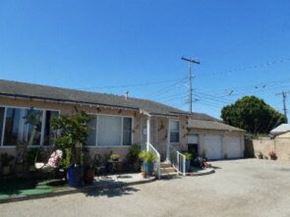 Oxnard apartment for rent - a house with a parking lot and a street