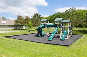 Stoughton apartment for rent - A playground with a green slide and a grey mat.