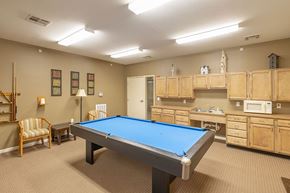 Decatur apartment for rent - A room with a pool table and a chair.