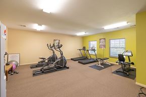 Decatur apartment for rent - A gym with treadmills, elliptical machines, and other exercise equipment.