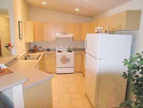 Neenah apartment for rent - a kitchen with a stove and a refrigerator