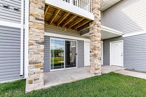 Duluth apartment for rent - A house with a stone pillar and a white door.