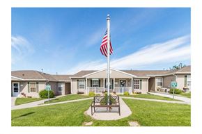 Bismarck apartment for rent - a flag pole with an flag in front of a house