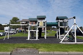 Greenville apartment for rent - a playground with two sets of play equipment