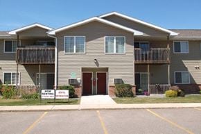 Rhinelander apartment for rent - a tan house with a red door