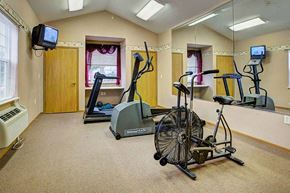 Portage apartment for rent - a gym with a treadmill and other exercise equipment