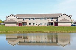 Kiel apartment for rent - a large building with a pond in front of it