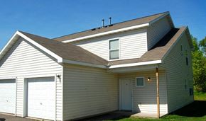 Duluth apartment for rent - A two-story house with a white exterior and a brown roof.