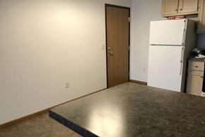 Rothschild apartment for rent - an empty kitchen with a refrigerator and a counter