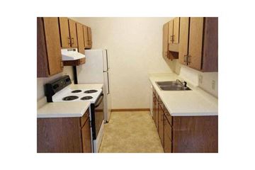 Wisconsin Rapids apartment for rent - a kitchen with a stove and a refrigerator
