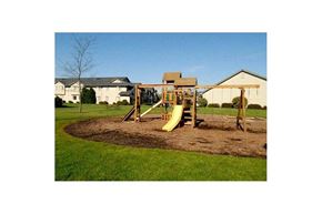 Lomira apartment for rent - a playground with a swing set in a yard