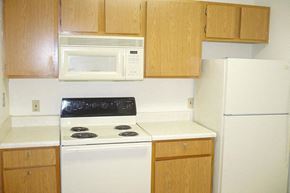 Carroll apartment for rent - a kitchen with a white stove and a microwave
