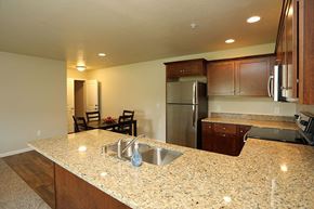 Jackson apartment for rent - a kitchen with a granite counter top and a stainless steel refrigerator