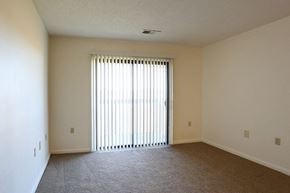 Greenville apartment for rent - an empty living room with a large window and