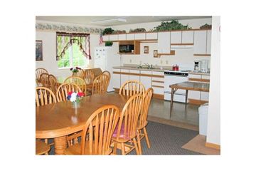 Black River Falls apartment for rent - a kitchen with a wooden table and chairs