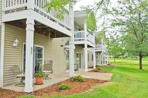 Viroqua apartment for rent - the front of a house with a porch and a lawn