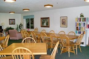 Green Bay apartment for rent - a dining room with wooden tables and chairs