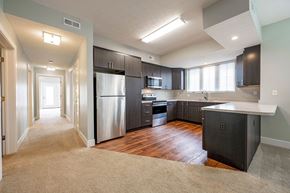 Hartford City apartment for rent - A kitchen with a refrigerator, oven, and microwave.