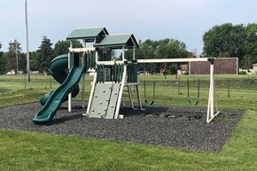 Newton apartment for rent - a playground with a slide and a swing set