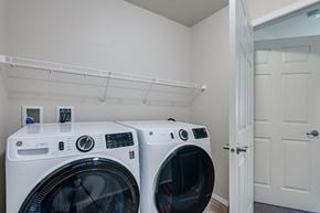 Union Grove apartment for rent - Two front load washing machines in a laundry room.