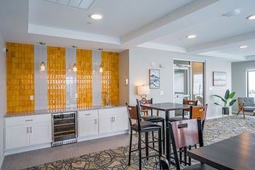 Stewartville apartment for rent - A kitchen with a dining table and chairs.